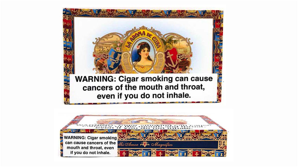 Cigar box images included in the lawsuit depict the sheer size and stark format of the warning labels.