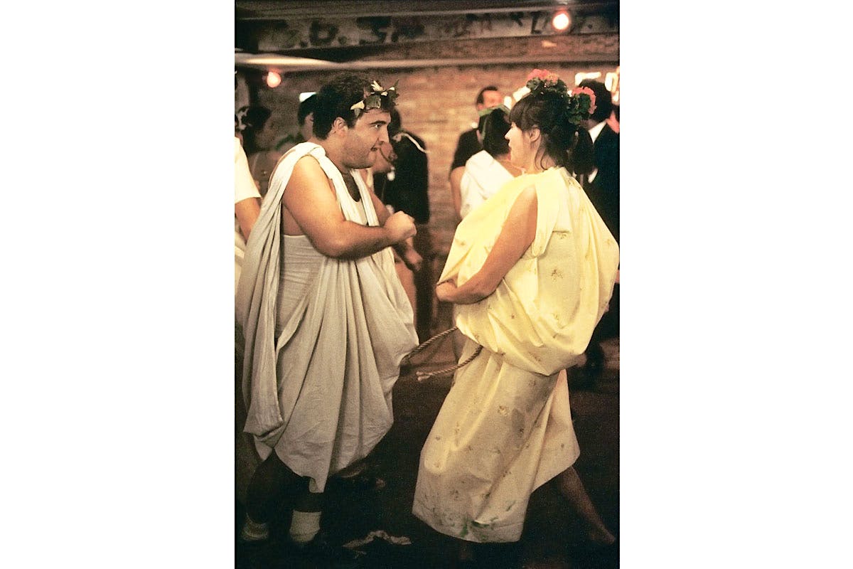 How do you react to a threat from the rulers of the college? Throw a raucus toga party.