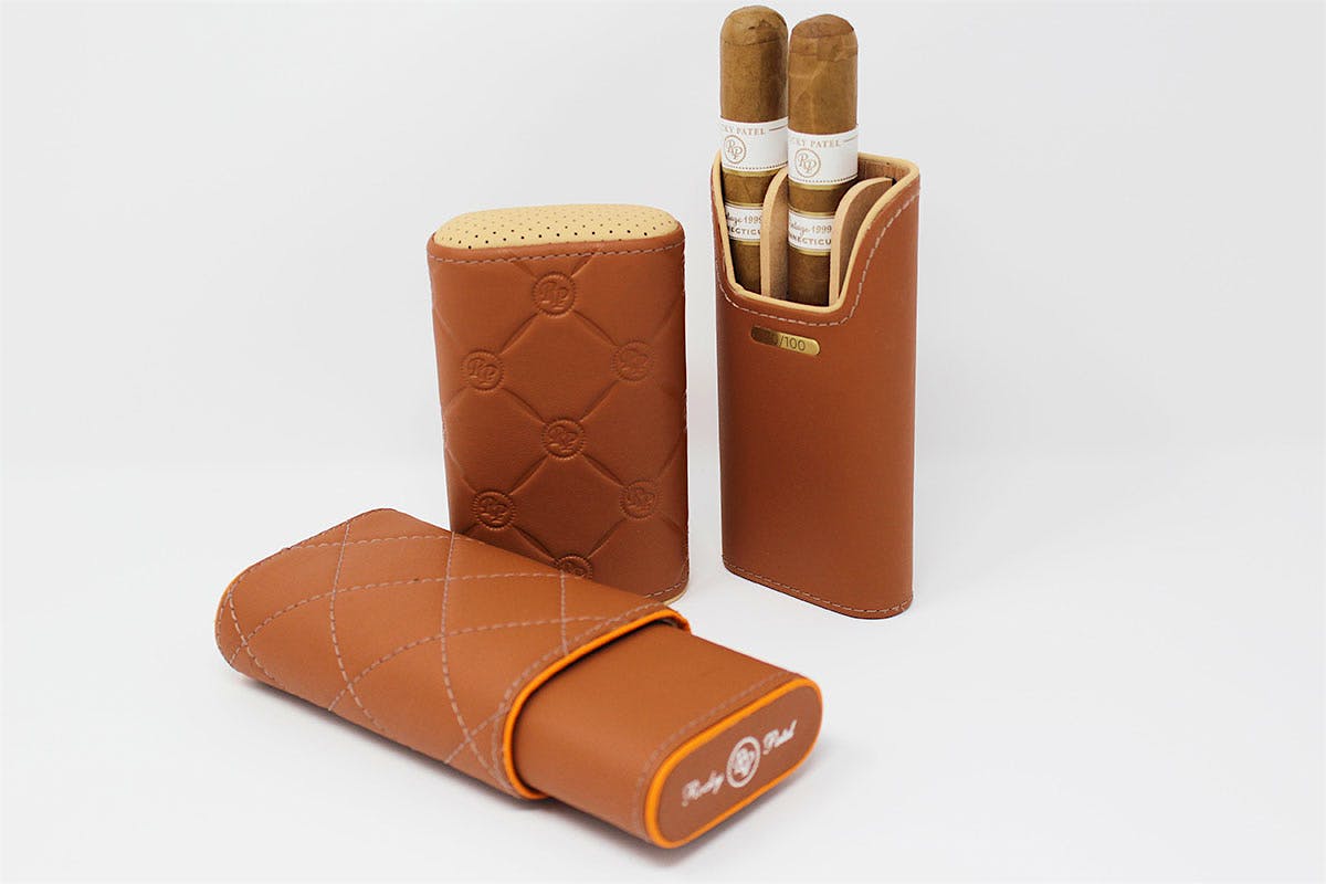 The DBS Collection for Rocky Patel consists of three-finger leather cigar cases inspired by the interior of an Aston Martin.