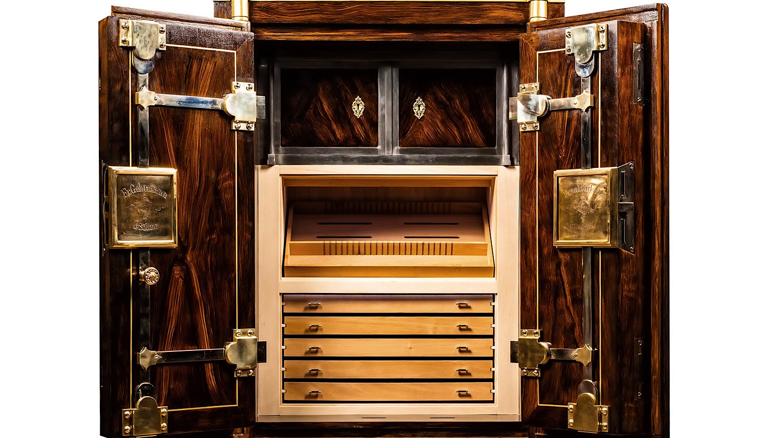 The cedar-lined cabinet, which consists of five drawers and one tray, holds up to 1,000 cigars.