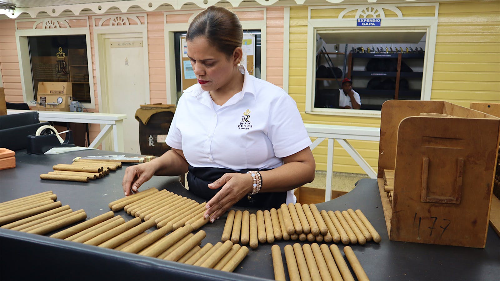 A cigar sorting table inside De Los Reyes Cigar Factory.