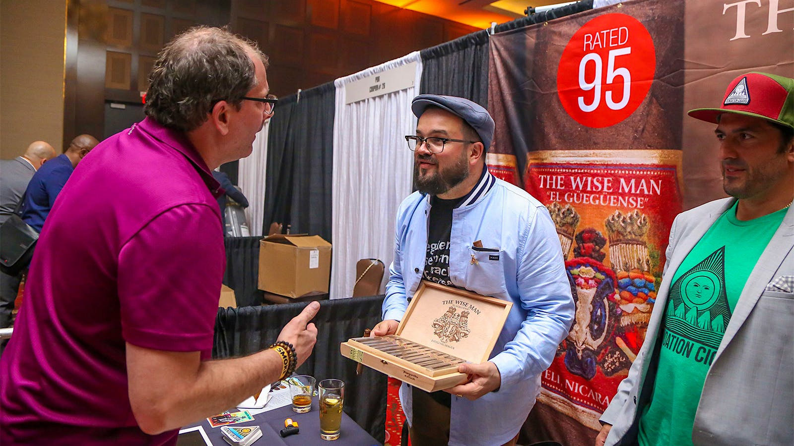 Foundation Cigars owner Nick Melillo talks with a guest at his booth.