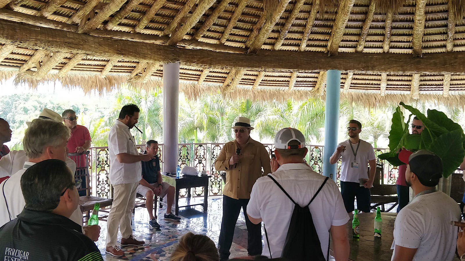 Carlos Fuente Jr., standing at Chateau de la Fuente, tells visitors the story of how he defied critics by growing wrapper-quality tobacco in the Dominican Republic.