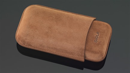 A Suede Cigar Case And Lighter From Siglo