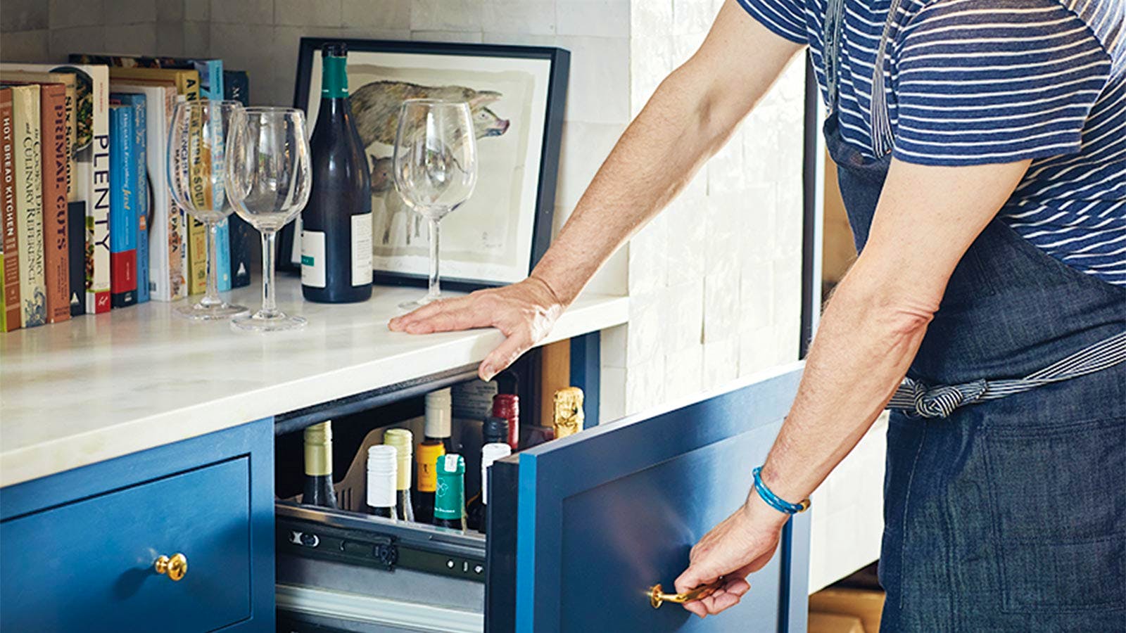 Pull-out drawers, with temperature control, store the ready-to-drink wine collection. Photo by Ty Cole