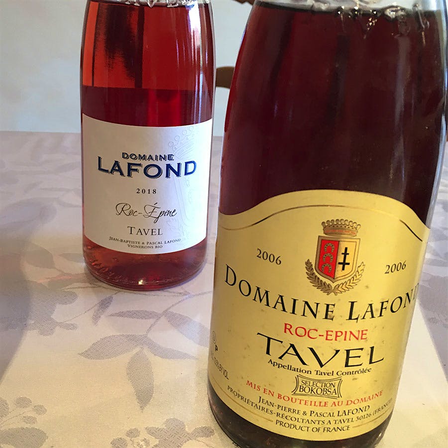 Two bottles of Tavel, one a deep pink, the other closer to ruby.