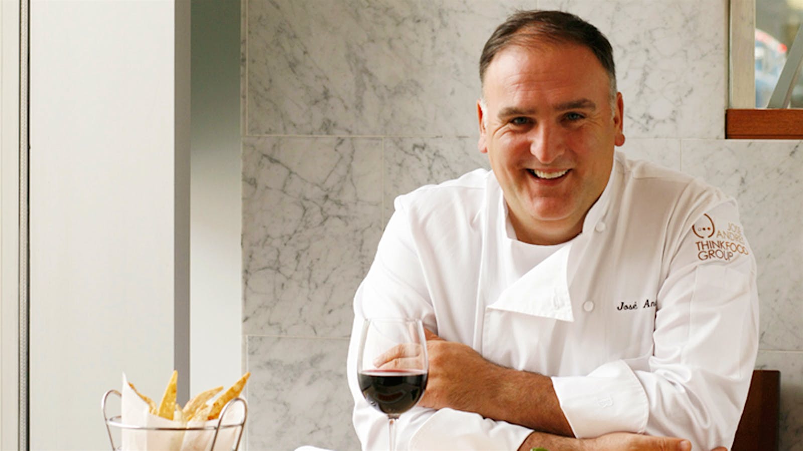José Andrés with a glass of red wine