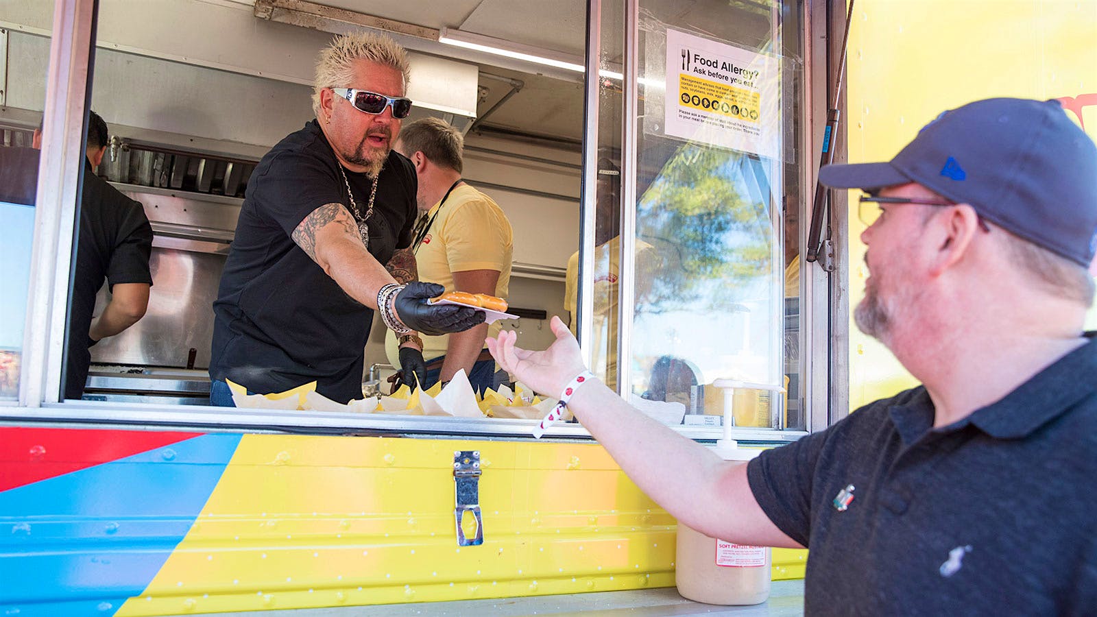 Guy Fieri serving Super Bowl snacks