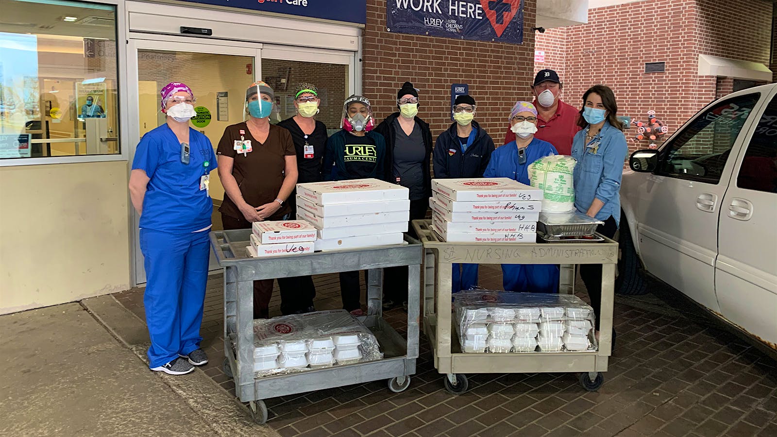 Hospital workers receiving meal packages