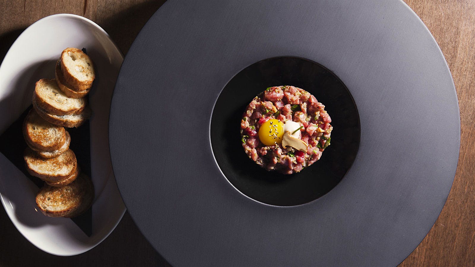 Steak tartare with a side of toasts at RPM Steak