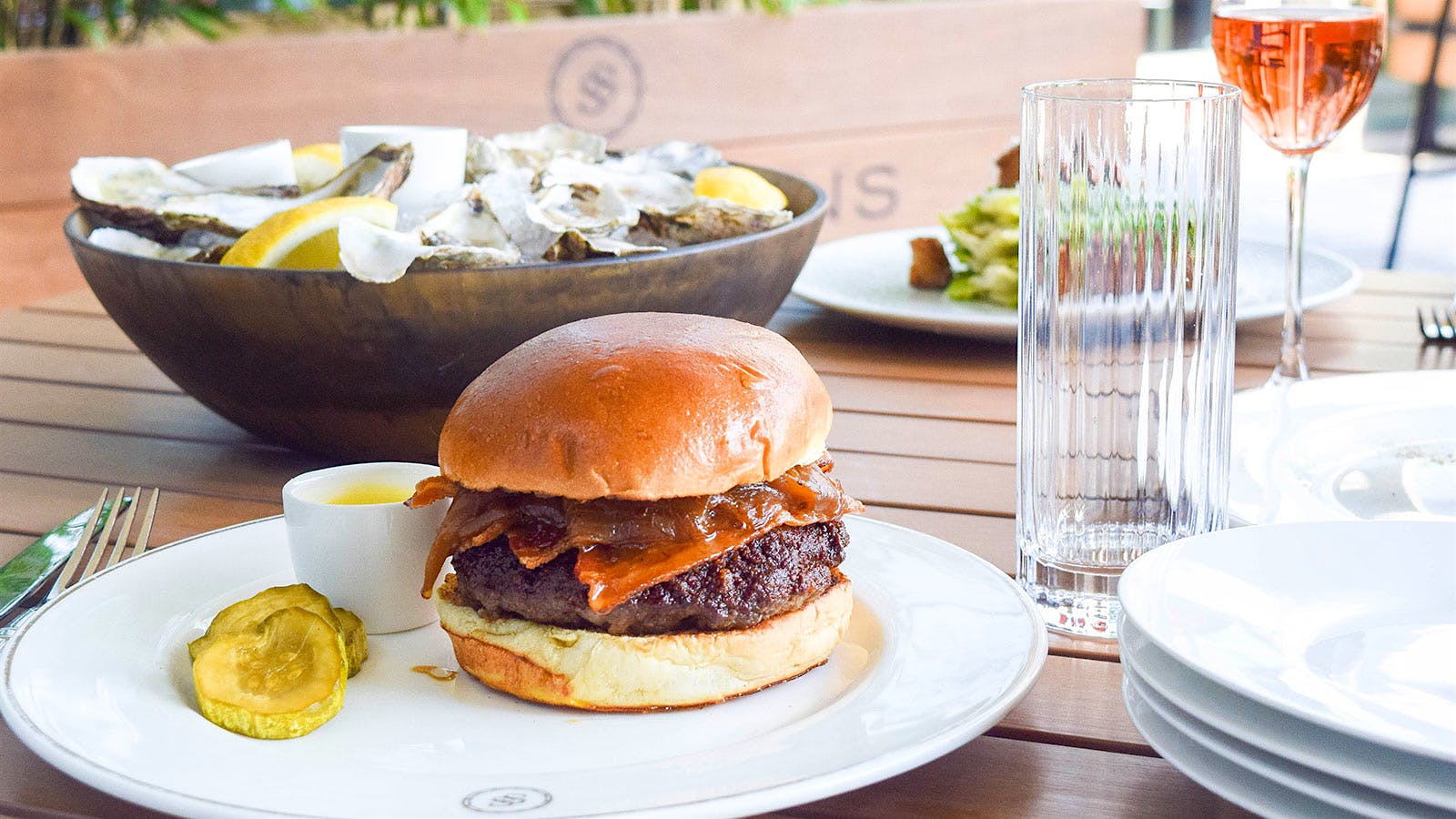 A burger at Swift & Sons patio
