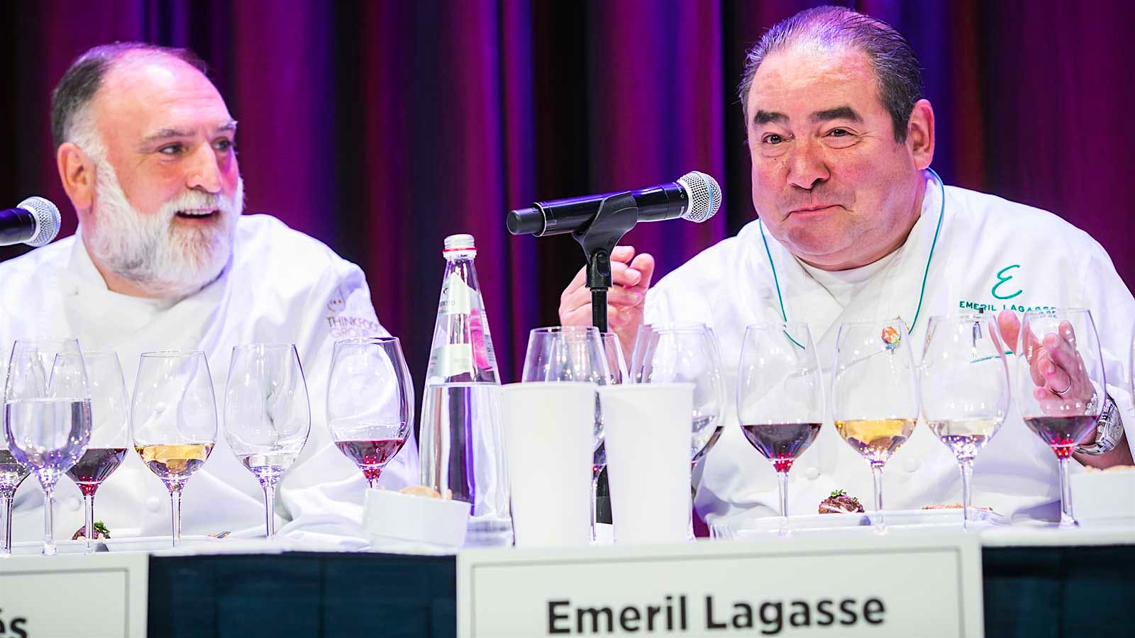 Chefs José Andrés and Emeril Lagasse on stage at a wine and food pairing seminar