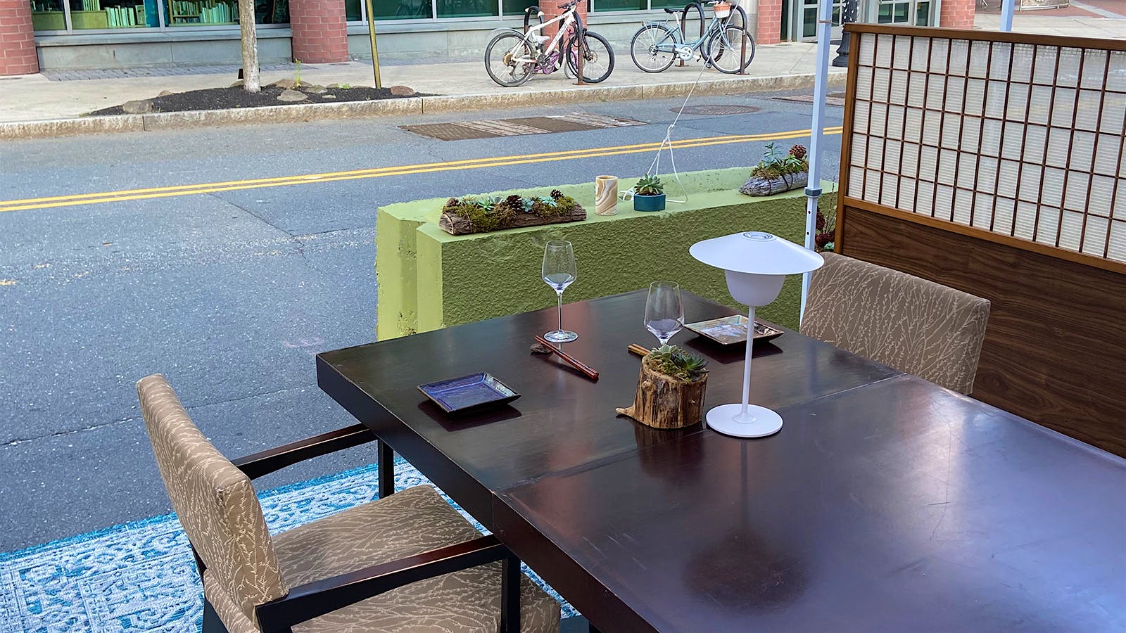 A set table in the expanded outdoor dining area at Elements