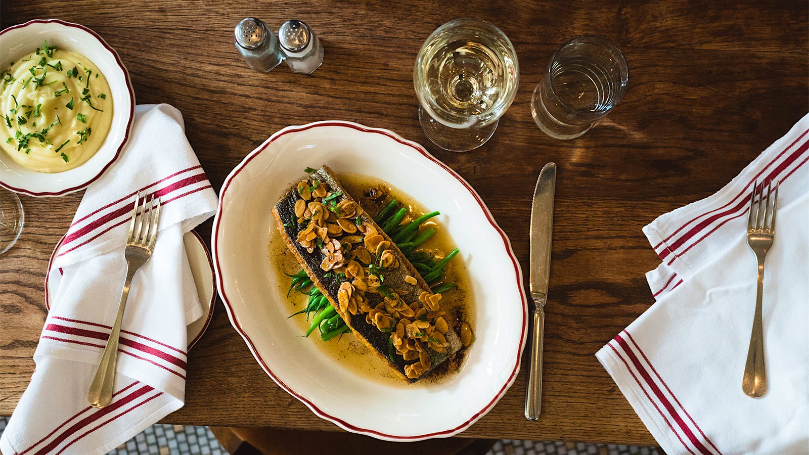 Trout Amandine with a glass of white wine at Le Diplomate