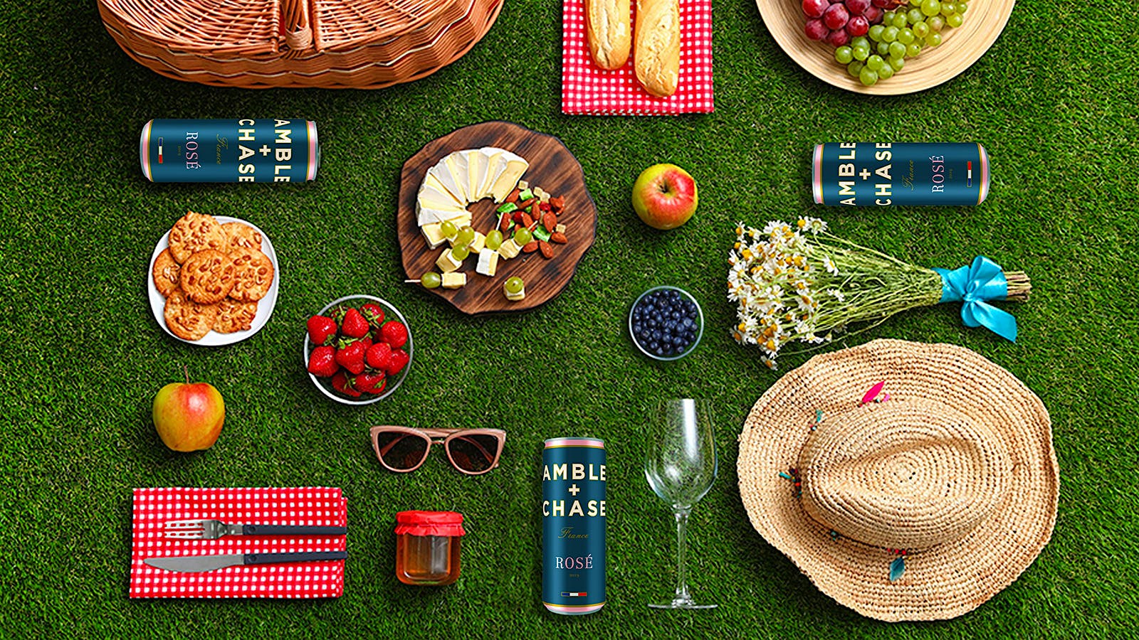 Food, cans of wine and other items laid out for a picnic