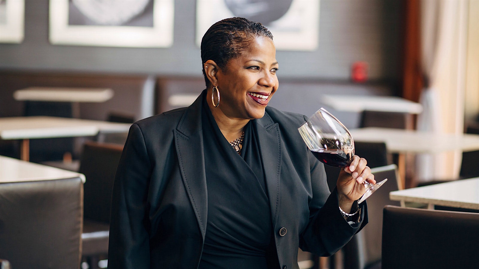  Portrait of wine director Tonya Pitts with a glass of wine in hand at One Market Restaurant