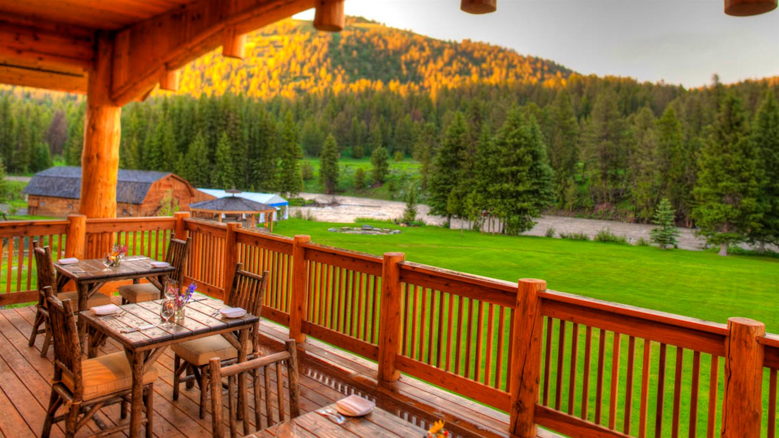 Tables set on the porch of Rainbow Ranch Lodge