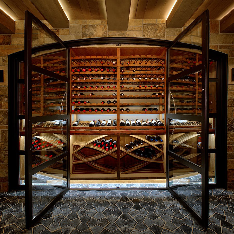 The design of wine collector Mike McCurdie's cellar mixes stone and wood elements for a variety of textures and tones.