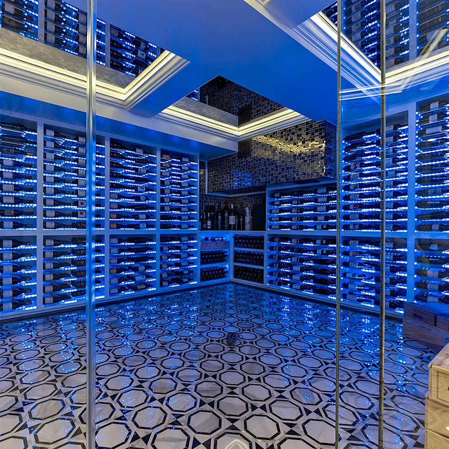 The design for Jacqueline and Greg Monteferrario's luminous, glass cellar was inspired by their visits to Las Vegas.