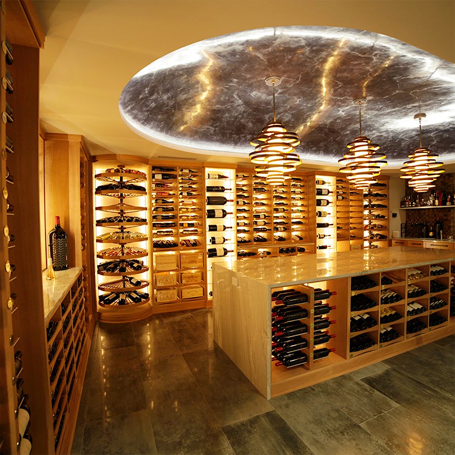 Revel installed dramatic lighting in the cellar of Piyush Patel, who owns about 2,000 bottles.