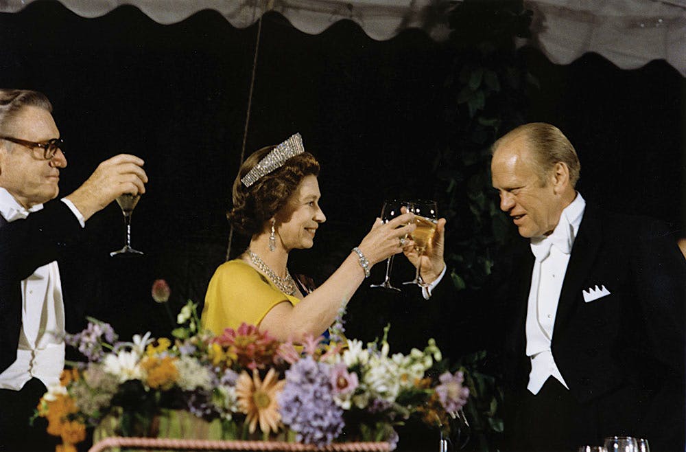 President Gerald Ford shares a toast with Queen Elizabeth II to celebrate the 200th anniversary of America’s independence from Great Britain.