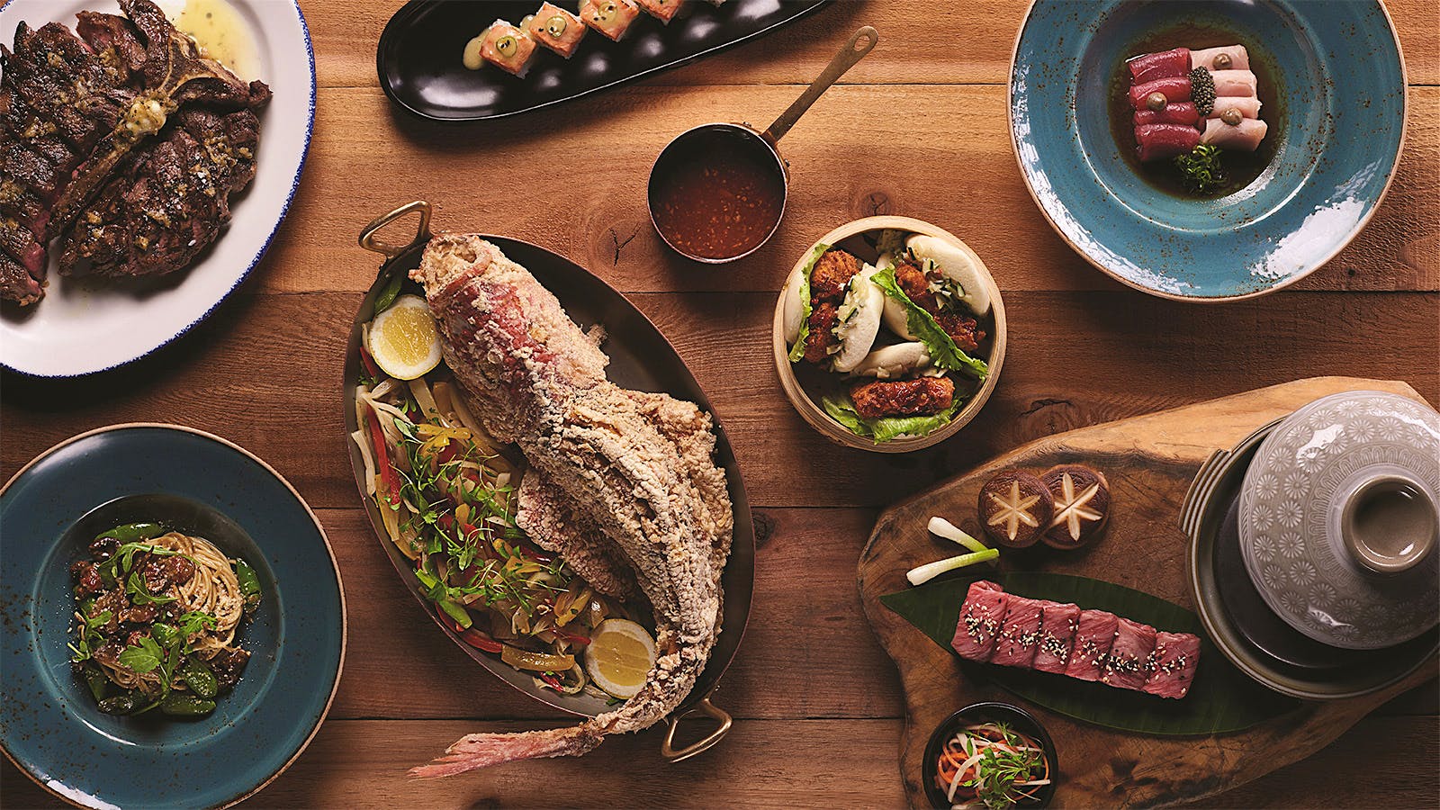 An overhead view of a spread of dishes at Catch