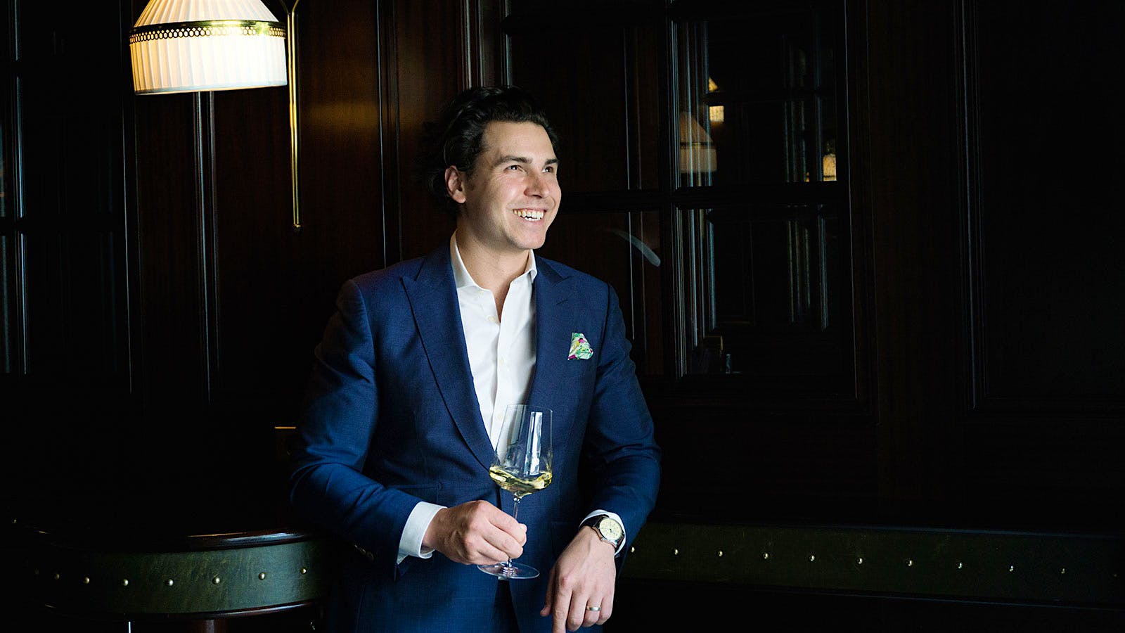 NoMad New York’s wine director, Thomas Pastuszak, holding a glass of white wine