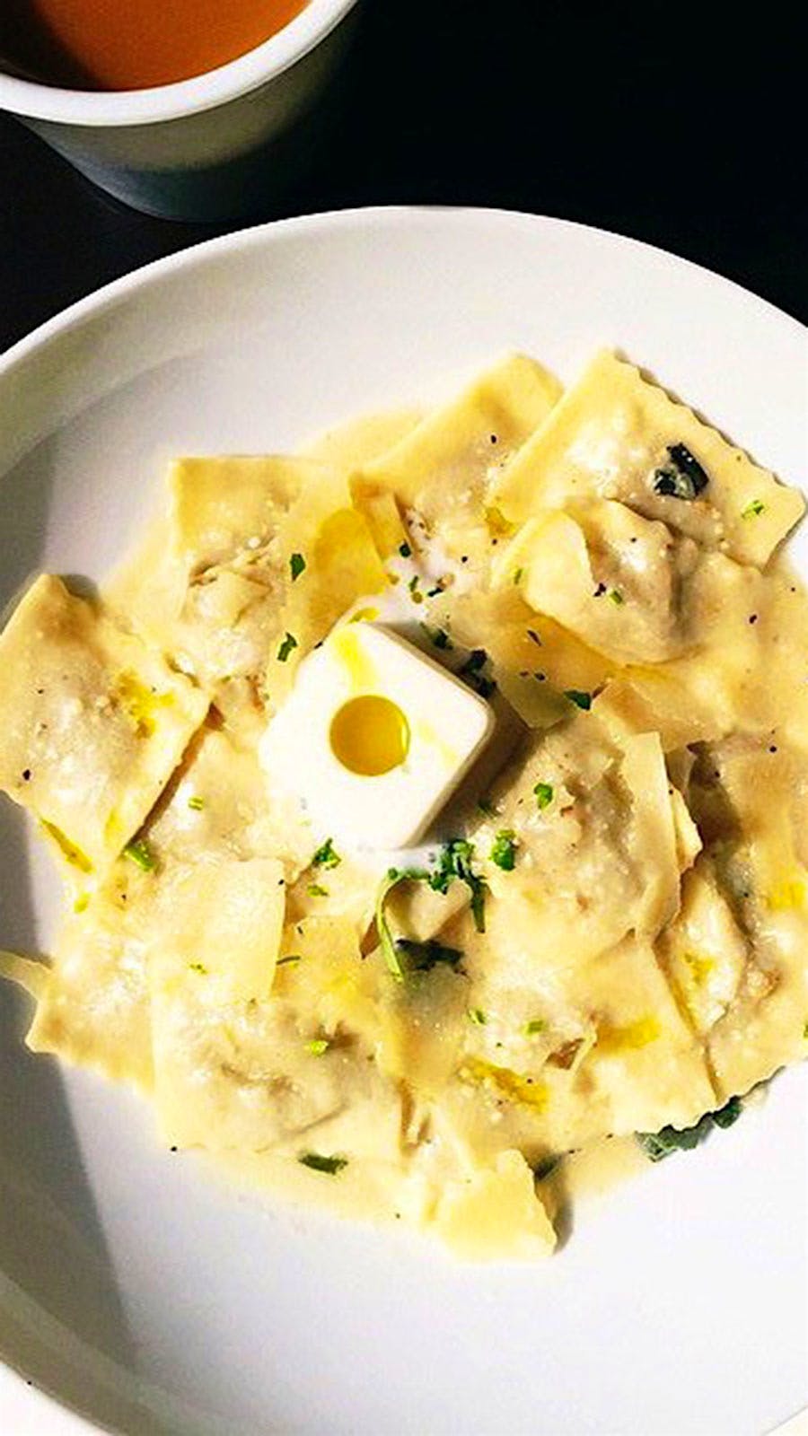 Raviolis on a white plate at Gran Caffe L’Aquila