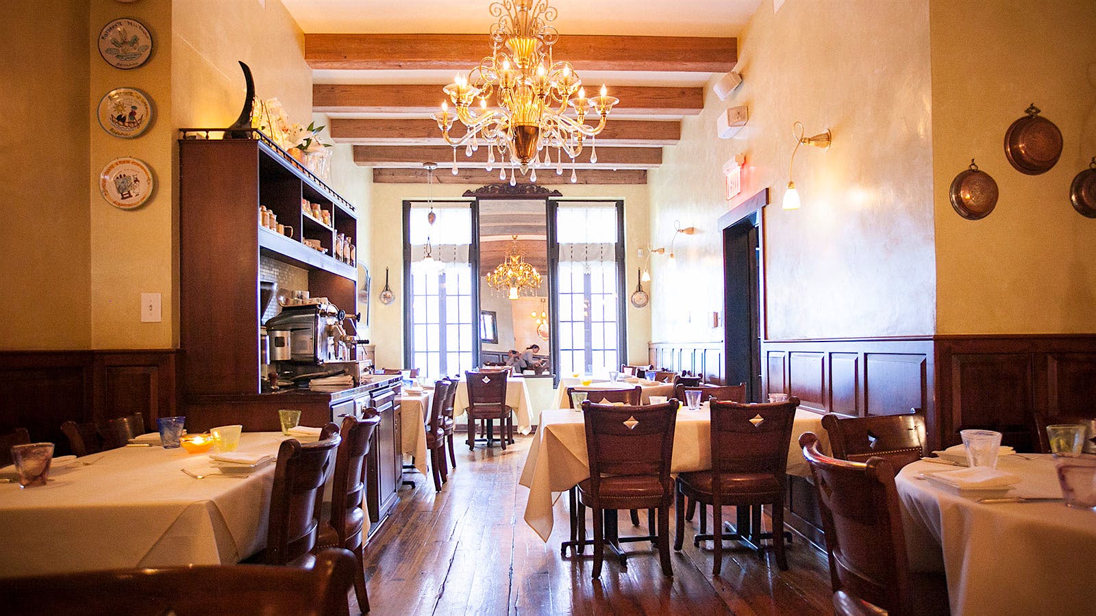 Interior shot of tables set in the dining room at Vetri Cucina