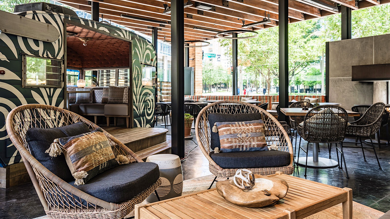  Outdoor patio area with a retractable roof at Haywire in Dallas 
