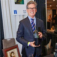 Paul Hobbs holding a bottle of his Cabernet Sauvignon