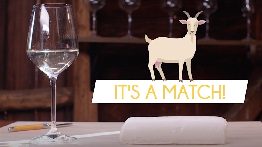 Glass of Sauvignon Blanc, log of chévre cheese and an illustration of a goat with the words "It's a Match!"