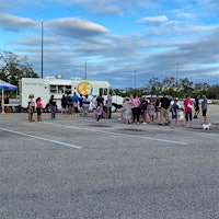 Florida residents line up for meals from a World Central Kitchen food truck; the charity group had workers and supplies in place two days before the storm.Restaurants Across Florida Weather Hurricane Ian, Respond with Help for Neighbors