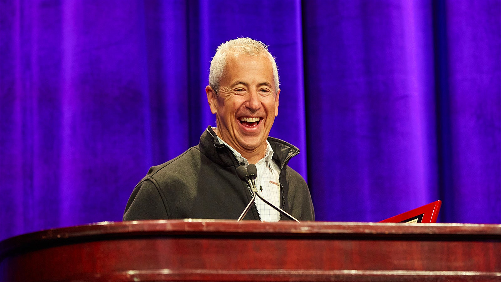  Restaurateur Danny Meyer at the Wine Experience podium with a big smile on his face