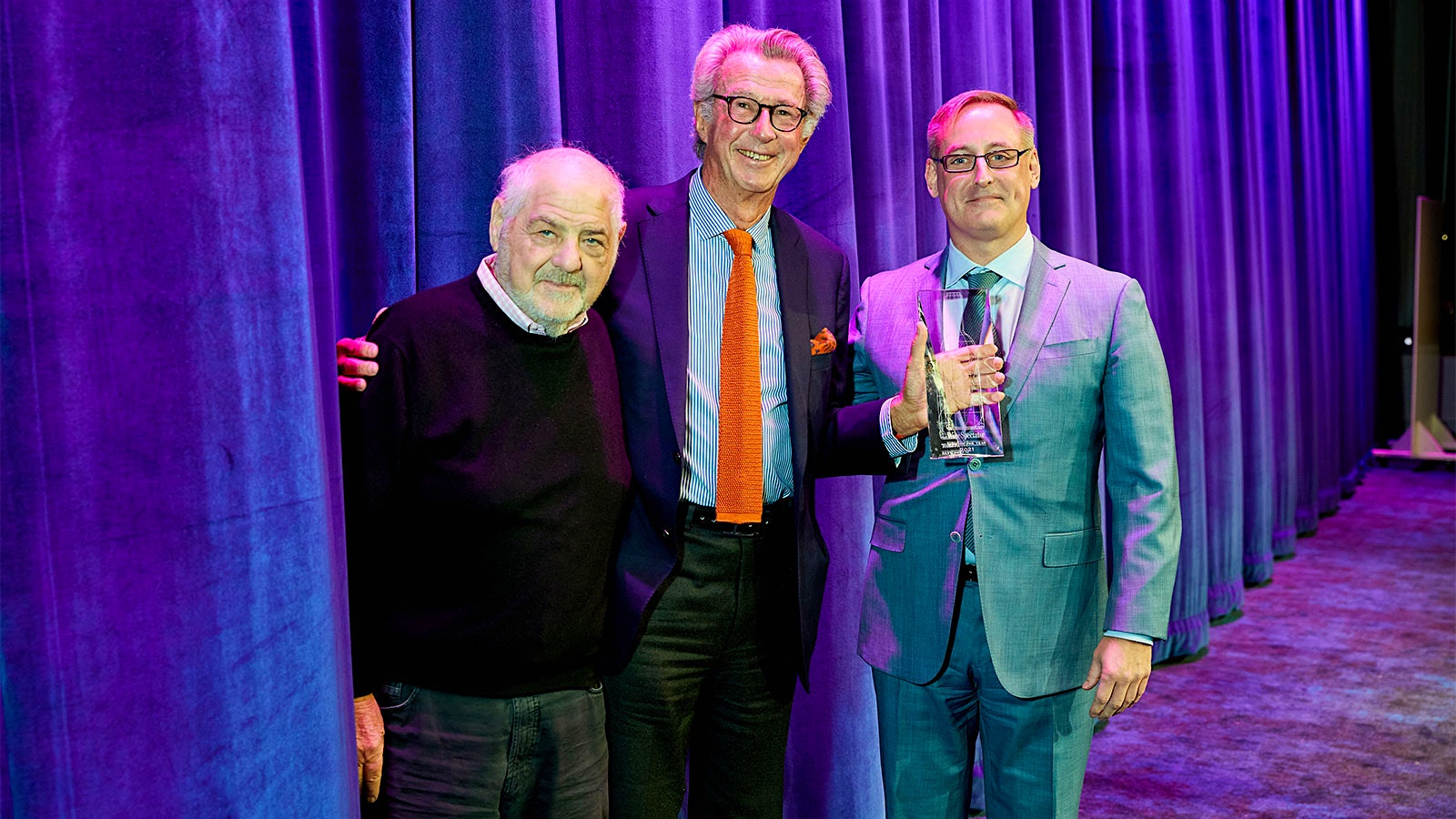  From left, Wine Spectator editor and publisher Marvin R. Shanken, Dominus founder Christian Moueix holding the 2021 Wine of the Year award and senior editor James Molesworth