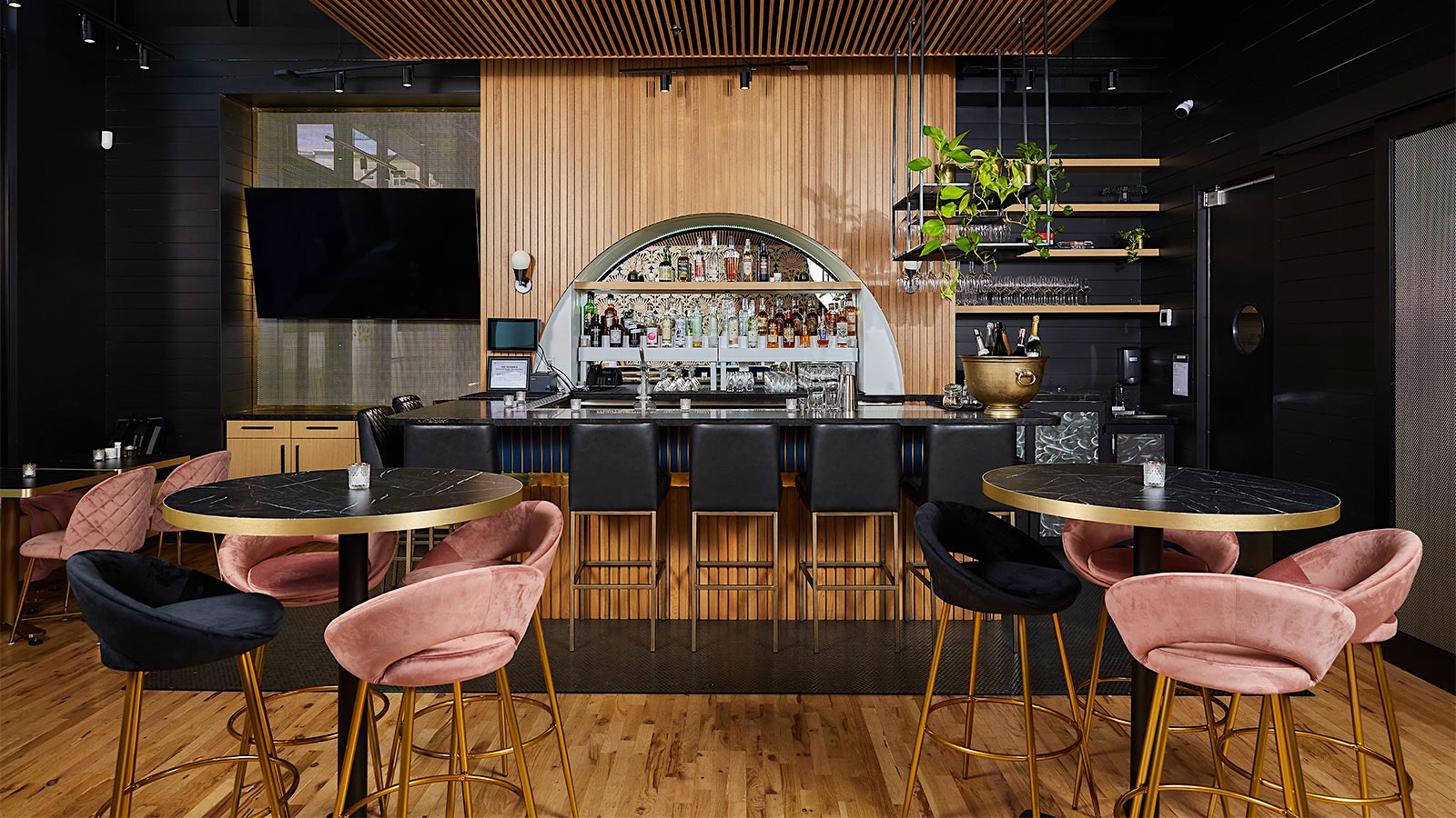  The sleek bar area at Bar Moore in Bellevue, with bottles displayed in an arched inset