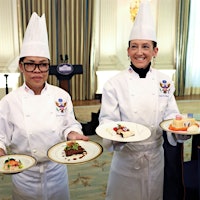 White House executive chef Cristeta Comerford (left) and executive pastry chef Susie Morrison presented the menu for the state dinner for French President Emmanuel Macron.France's Macron Sips California Wine at White House State Dinner