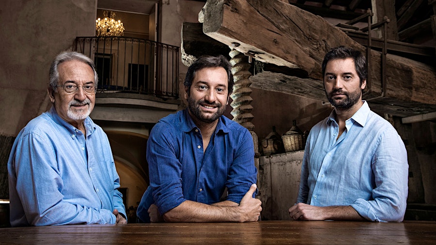 Giuseppe Benanti, left, built a winery on Sicily's Mount Etna, grabbing the world's attention. He handed it off to his sons Antonio, center, and Salvino, in 2012.