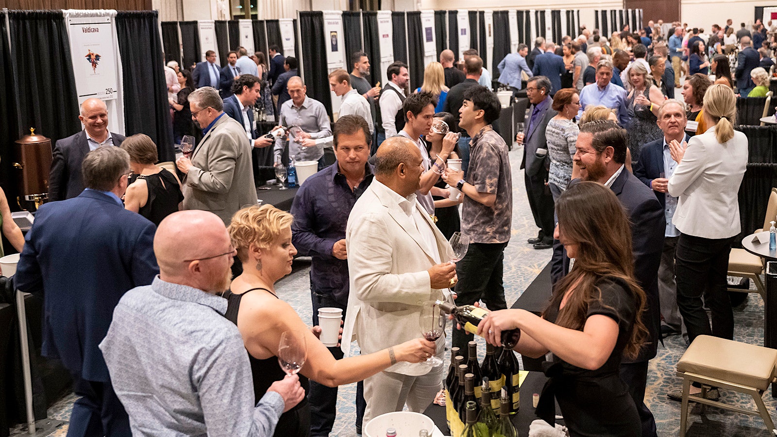  A crowded aisle of guests tasting at booths at the 2022 Grand Tour in Las Vegas