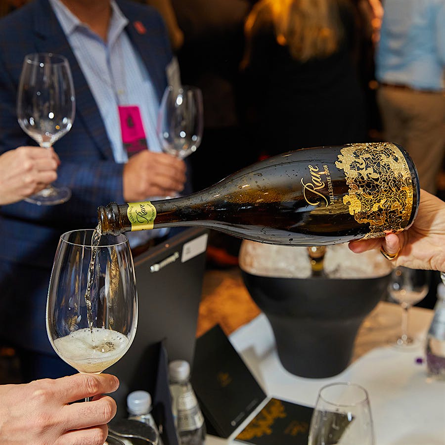 Bottle of Rare Champagne being poured at a Wine Spectator tasting event