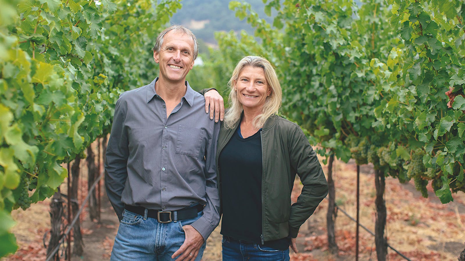 California winemakers Joel and Sarah Gott standing in a vineyard