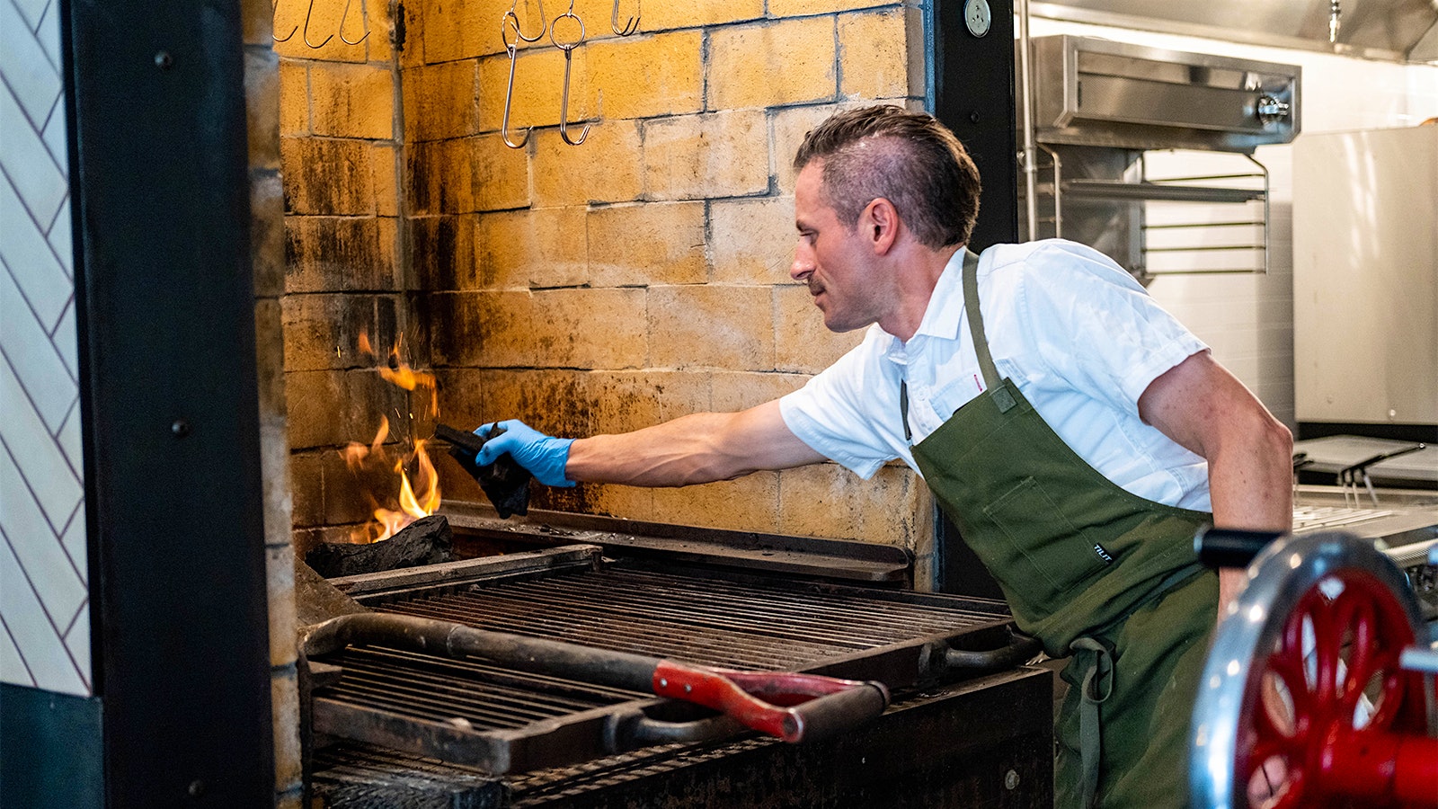  Chef Matthew Accarrino working at Mattin's charcoal oven