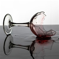 A broken wine glass with residue of red wineWhen Wine Goes Wrong