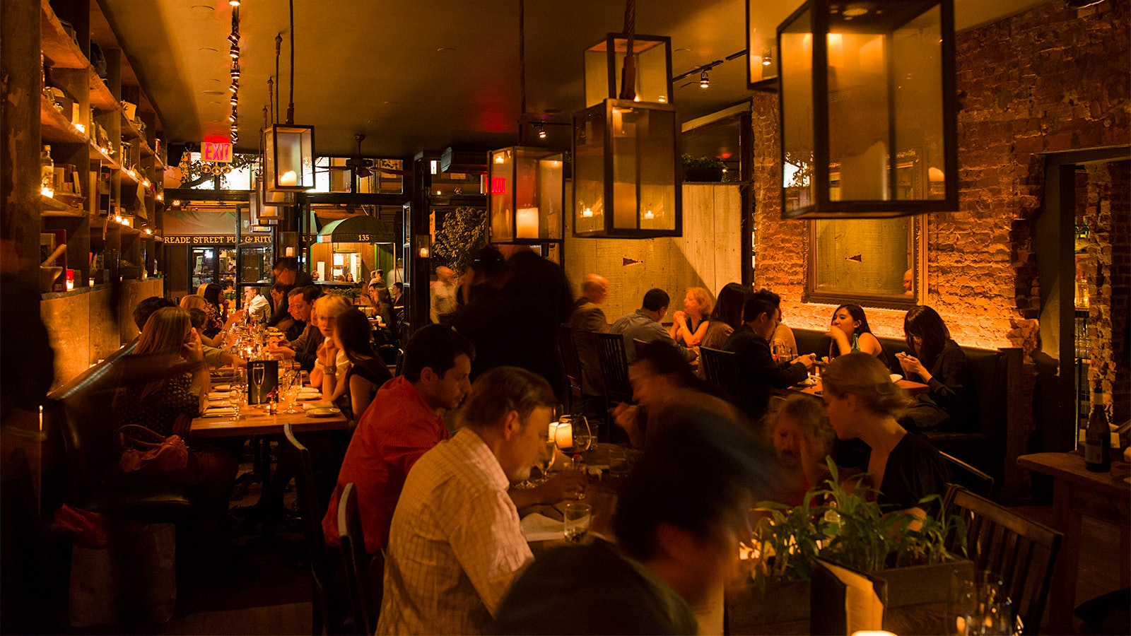  A view of Marc Forgione Restaurant's original, cozy, dimly lit dining room from back to front
