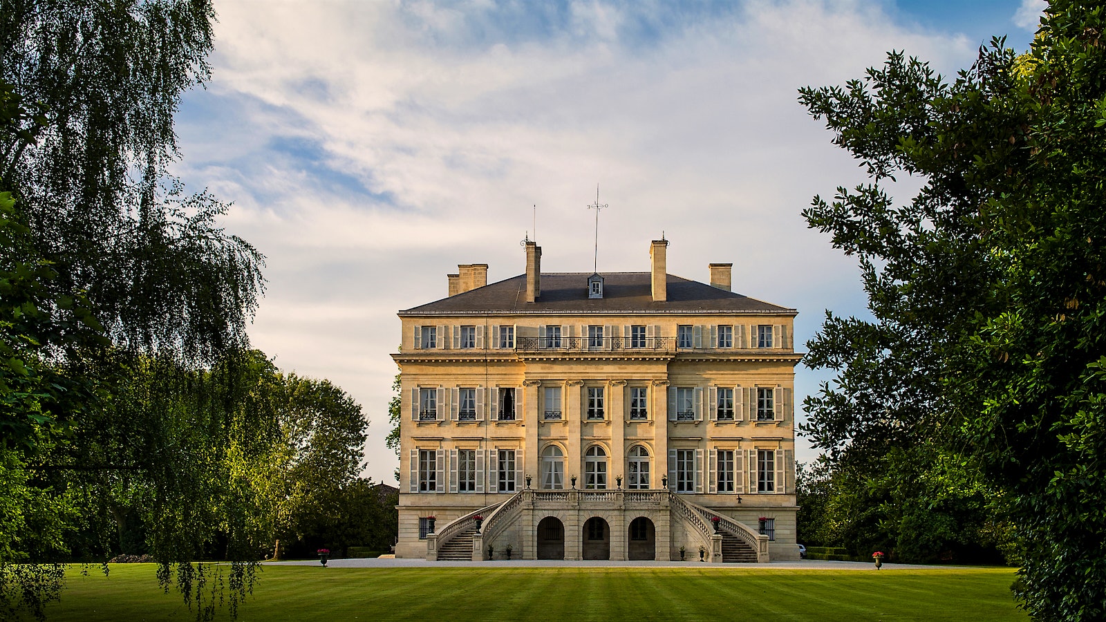  Chateaux Margaux's estate house is pictured with a blue sky