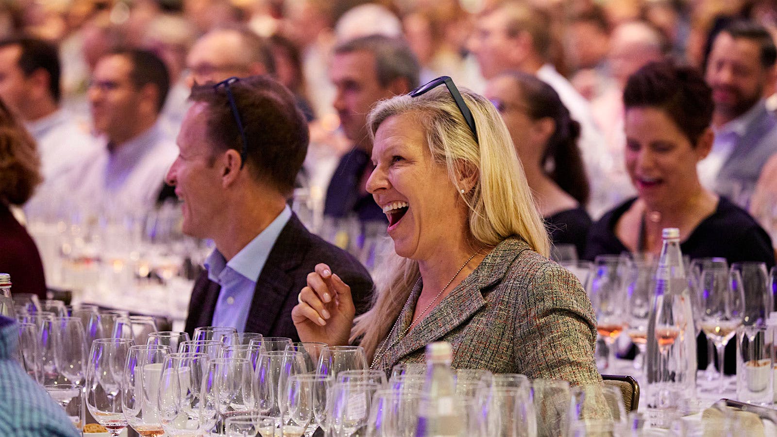  A woman laughing while tasting during a Top 10 seminar at New York Wine Experience.