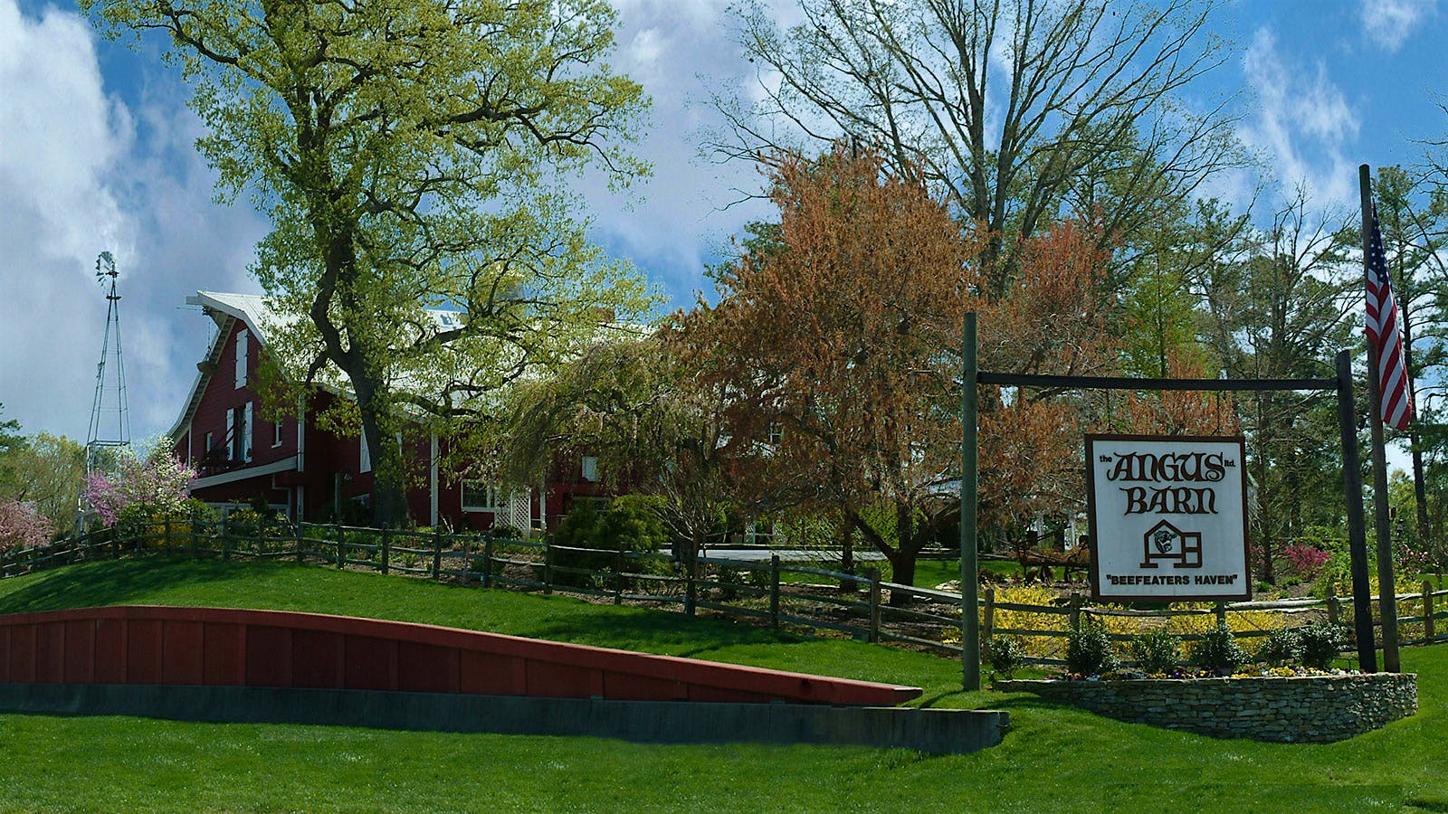  The red exterior of the Angus Barn and surrounding grounds and grass