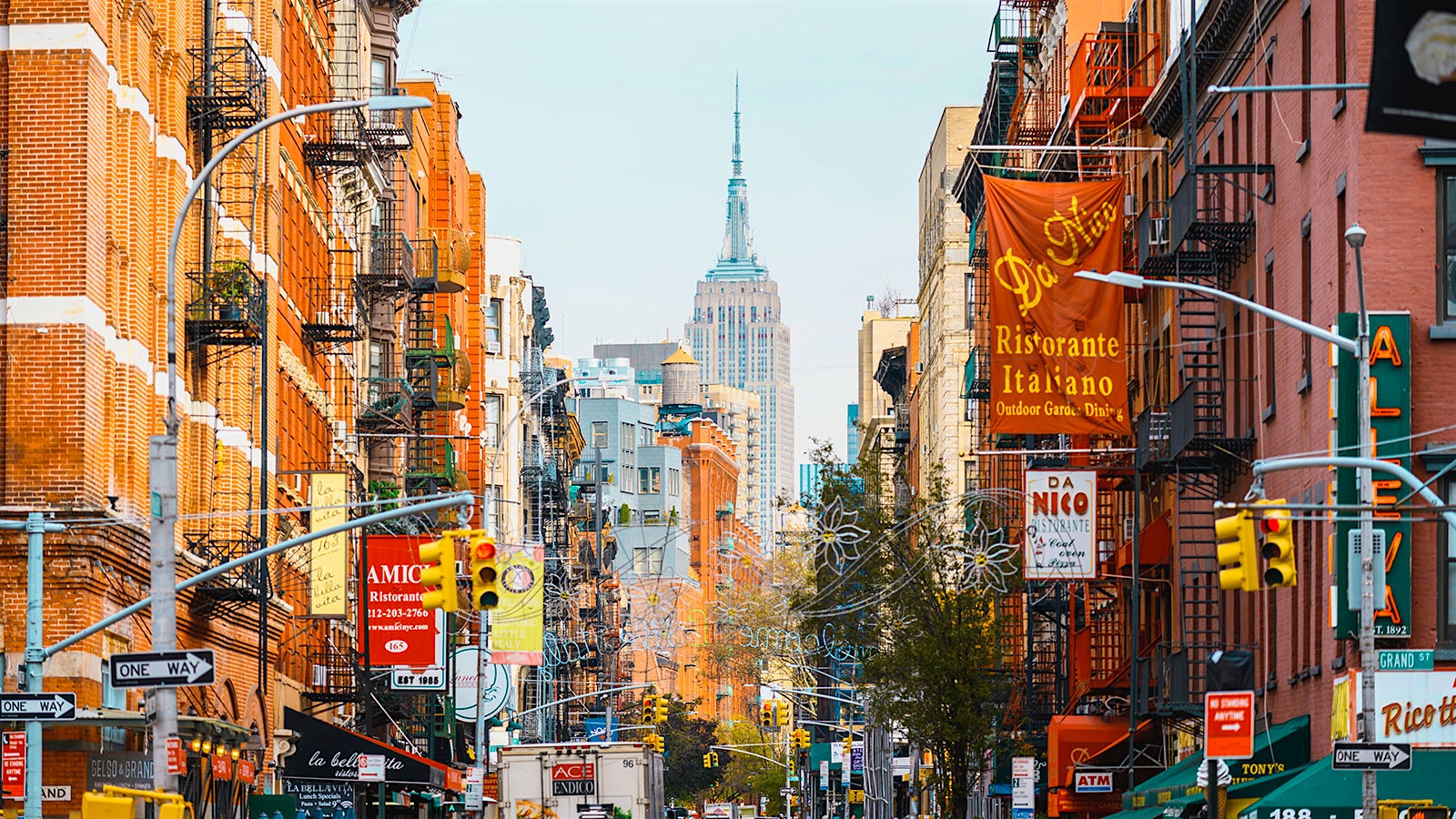  A street in New York City's Little Italy neighborhood, with the Empire State Building in the background