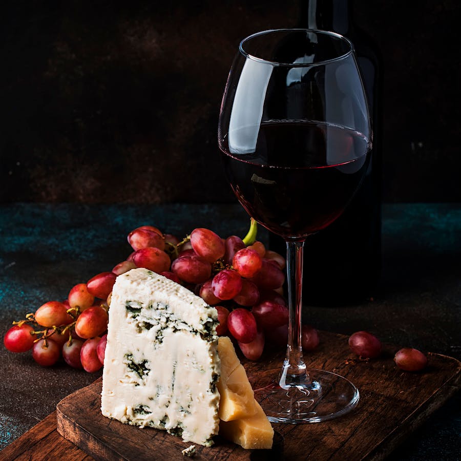 Often served as an after-dinner drink, Port pairs well with blue cheeses and hard cheeses such as Cheddar and Parmigiano-Reggiano.