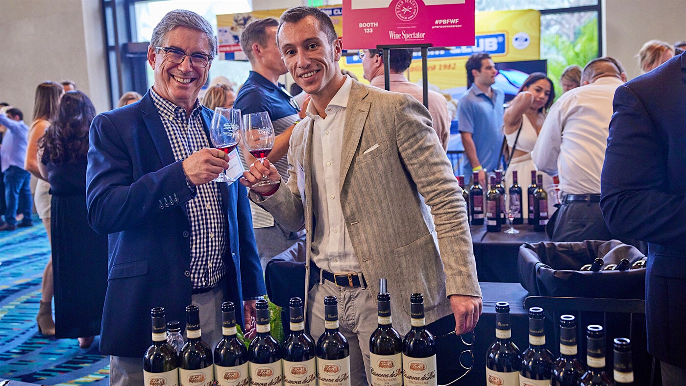  Gianlorenzo Neri of Montalcino raises a glass of Brunello with a guest at the Palm Beach Food &amp; Wine Festival.